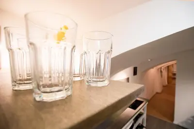 three glass vases sitting on top of a counter at The Maze Apartment in Ljubljana