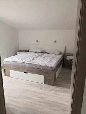 a bedroom with a bed in a room at Apartma Logar in Kobarid