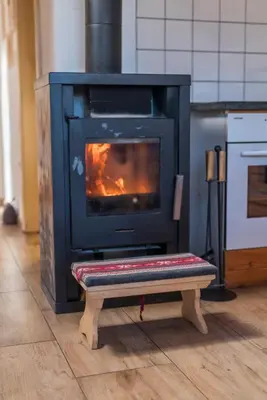 a stove sitting on a bench in a kitchen at Hike & Bike Chalet in Bohinj