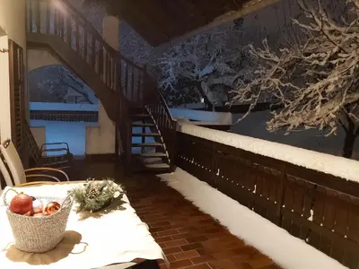 a table with a basket of fruit on a balcony at Apartments & Rooms Florjana in Bled
