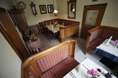 an overhead view of a restaurant with a table and chairs at Šiker B&B Hotel in Pernica