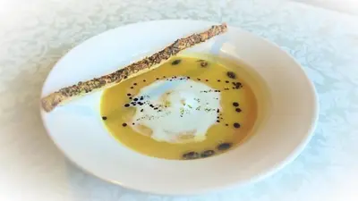 a plate with a egg in a bowl of soup at Šiker B&B Hotel in Pernica