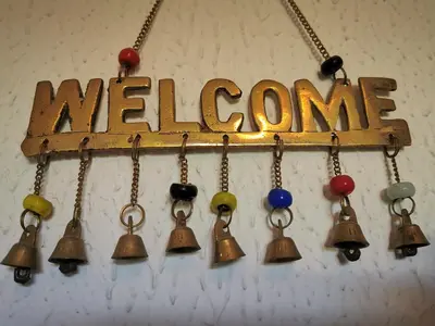 a group of bells hanging from a sign with the word marrow at Apartments Poldi in Bled