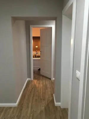 an empty room with a hallway leading to a bedroom at Apartma Lilly in Bled