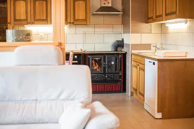 a kitchen with an oven with a stove at Valley View Holiday Home with Sauna Mrak in Slappe dʼIdria