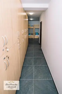 a hallway with lockers in a locker room at Hostel Bled Paradise Slovenia in Bled-Rečica