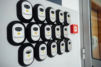 a wall of white and black toasters on a wall at Sobe Rooms Nataly in Sežana