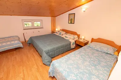 a bedroom with two beds in a room at Penzion Na Hribu in Slap