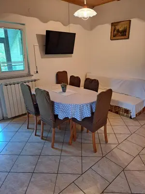 a dining room with a table and chairs at Penzion Na Hribu in Slap