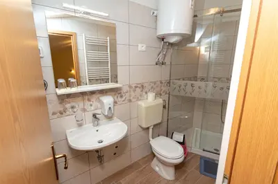 a bathroom with a toilet and a sink at Penzion Na Hribu in Slap