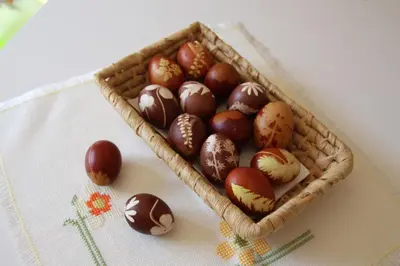 a basket filled with different types of easter eggs at Apartments Na Vasi in Bohinj