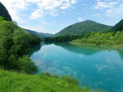 a river in the middle of a valley at The Millhouse Bled in Bled