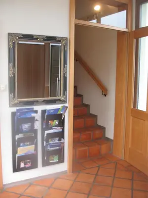 a room with a staircase with a window and a door at Bed & Breakfast Na Poljani in Kranj
