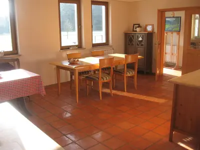 a dining room with a table and chairs at Bed & Breakfast Na Poljani in Kranj