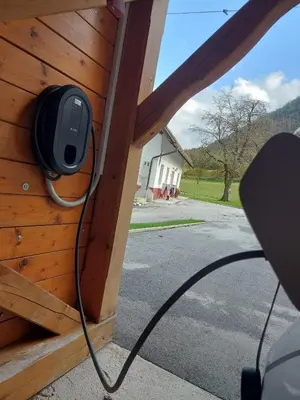 a television attached to the side of a house at Apartma Stenar in Mojstrana