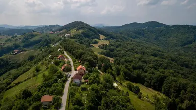 an aerial view of a house on a mountain at PLANINCA -hiša z razgledom in Šmarje pri Jelšah