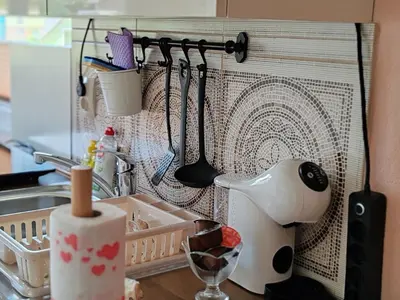 a kitchen counter with a sink and utensils at Two Angels in Bled