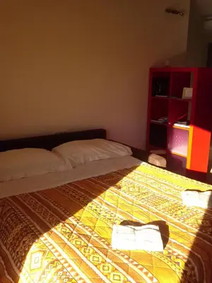 a bedroom with a bed with towels on it at Krasen Kras Apartment in Komen
