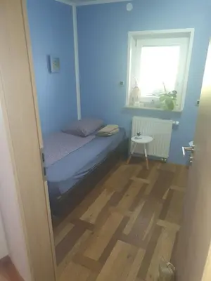 a small bedroom with a bed and a window at Sanja apartment near to Ljubljana in Preserje pri Radomljah
