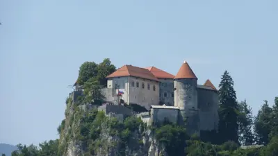a castle on top of a mountain at Apartment Pod Skalco in Jesenice