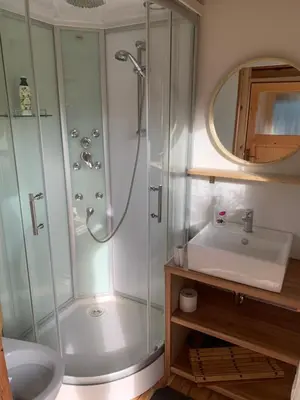 a bathroom with a shower and a sink at Hillside Bio Resort Delux Apartments in Šešče pri Preboldu