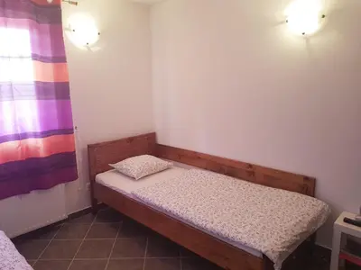 a small room with a small bed in it at Wine House Kaloh in Maribor