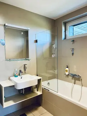 a bathroom with a sink and a shower at Villa Mari I in Maribor