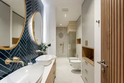 a bathroom with two sinks and two toilets at Apartment Zoja in Kranjska Gora