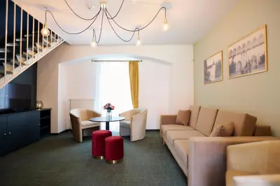 a living room with a couch and a table at Mokrice Castle Estate in Čatež ob Savi