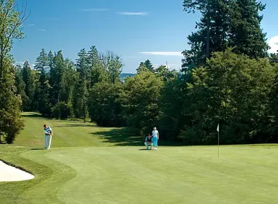 a group of people playing golf on a golf course at Mokrice Castle Estate in Čatež ob Savi