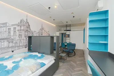 a room with a bed and a drawing on the wall at RIVER SIDE CENTRAL MARKET - Eclipse superior apartment in Ljubljana