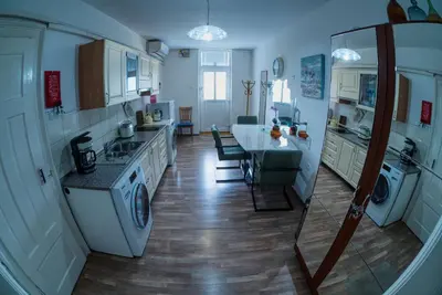 a large kitchen with a sink and a stove at Apartma MB-Center in Maribor