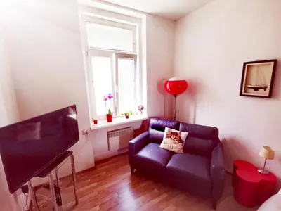 a living room with a couch and a television at Apartma MB-Center in Maribor