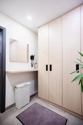 a room with a wardrobe and a trash can at GOSTILNA S PRENOČIŠČI PAV in Rakek
