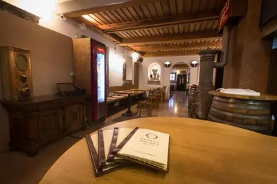 a room with a table with a book on it at GLUTEN FREE Bed & Breakfast Dežela Okusov in Ljubljana