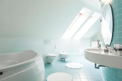 a bathroom with a toilet and a sink and a mirror at Vila Izabela in Križevci pri Ljutomeru