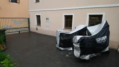 two black and white covers on a patio at Apartment Slavija in Škofja Loka