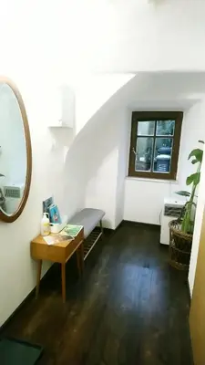 an attic room with a desk and a window at Apartment Slavija in Škofja Loka