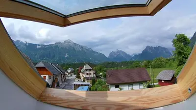 a view from a window of a village with mountains at Apartma Jernej in Bovec