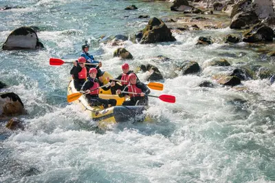 a group of people in a raft in a river at Apartma Jernej in Bovec