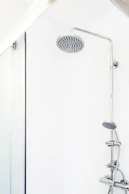 a shower with a glass door in a bathroom at Terasse Jeruzalem Apartments in Hermanci