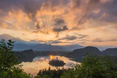 a view of a body of water with a sunset at 238 Spodnje Gorje in Spodnje Gorje