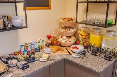 a kitchen counter with a bunch of food on it at Penzion Hosnar, apartma Time Out in Bovec