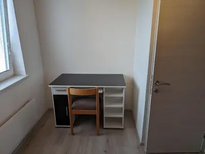 a desk in a room with a chair and a door at Apartment Bee near Bled in Zabreznica