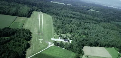 an aerial view of a tennis court in the middle of a forest at Apartma Kolpa in Gradac