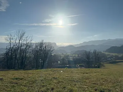a view of a field with the sun in the sky at Villa Dei Sogni in Bled