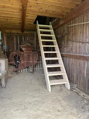 a ladder in the inside of a barn at Hrgova hiška in Ptuj