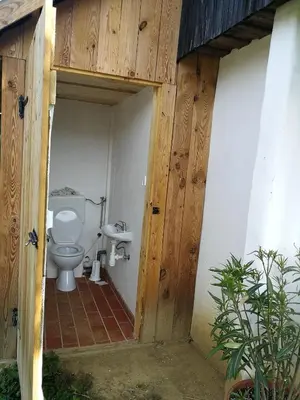 a bathroom with a toilet in a building at Hrgova hiška in Ptuj