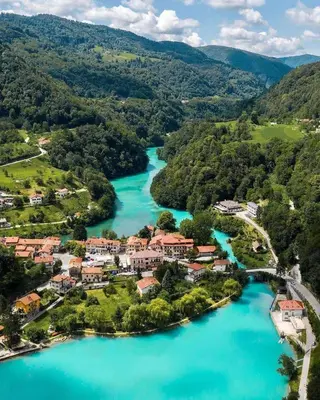 an aerial view of a town next to a river at House by the Lake in Most na Soči