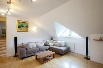 a living room with a couch and a table at Luxury apartment Karolina in Bled